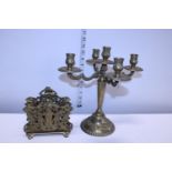 A brass candelabra and a brass Art Noveau style letter rack