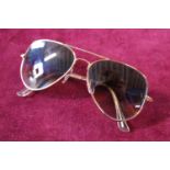 A pair of Rayban aviator sunglasses