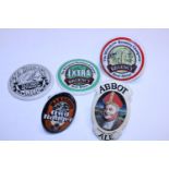 Five assorted ceramic beer pump labels