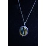 A 925 silver chain with a white metal and hardstone pendant