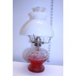 A vintage oil lamp with opalescent shade. Shipping unavailable