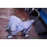 A vintage child's push a long toy dog, shipping unavailable