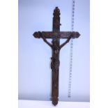 A large vintage wall hanging hand carved wooden crucifix. Postage unavailable
