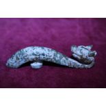 A antique Chinese Jade belt hook in the form of a Dragon