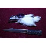A Scottish themed grouse foot brooch and a hallmarked Scottish silver sgian dubh style brooch