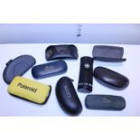 A job lot of empty designer glasses cases