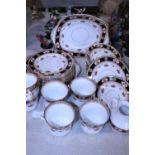 A Reid's bone china tea service (32 pieces) (one cup hairline crack, slight rub to gilt)