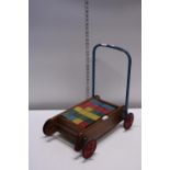 A vintage mid-century Tri-ang child's trolley and wooden blocks set, shipping unavailable