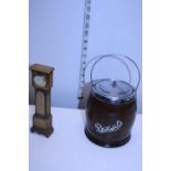 A novelty wooden grandfather clock and a oak and chrome biscuit barrel with enamel liner
