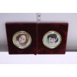 A pair of hand painted child portraits in velvet framed mounts