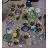 A large job lot of assorted paperweights