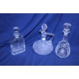 Three assorted cut glass decanters