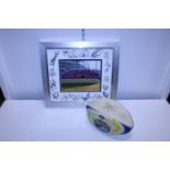 A signed Leeds Rhinos rugby ball and a framed signed picture of Leeds Rhinos for match against