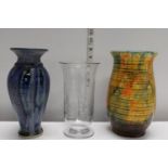 Two art pottery vases and a glass celery vase