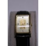 A Credit Swiss wristwatch with real gold ingot insert (small crack to glass)