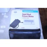One boxed digital blood pressure monitor and one other (untested)
