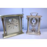 A heavy Churchill brass carriage clock and one other in working order