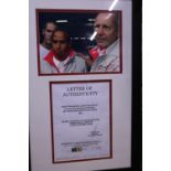 A framed hand signed photograph of Lewis Hamilton and Ron Dennis dated 2009 with COA