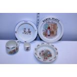 A selection of vintage baby plates and cups etc