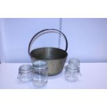 A heavy brass jam pan with four glass storage jars shipping unavailable