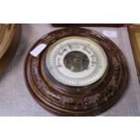 A antique oak framed barometer