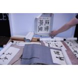 A Chinese collection of scrolls with watercolour ink and calligraphy