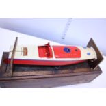 A vintage mid-century Hornby clockwork speedboat in good working order with key and bespoke made box