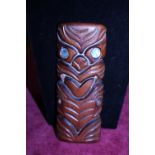 A hand carved wooden Tribal figurine with Abalone shell eyes 17cm