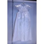 A new with tags child's christening gown