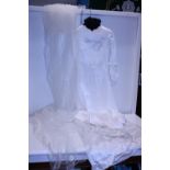 A vintage wedding dress (worn) with vintage veil