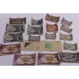 A job lot of WW2 Japanese issue military bank notes and two vintage ration books