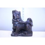 A antique Chinese hand carved wooden temple dog