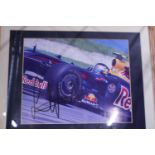 A framed hand signed photo of Sebastian Vettel dated 2009 with COA