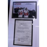 A framed and hand signed photograph of Lewis Hamilton and Fernando Alonso with COA