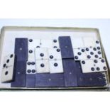 A set of vintage bone and ebony dominoes