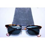 A pair of Gucci tortoise shell form sunglasses