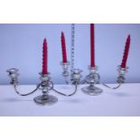 Two heavy silver plated two branch candelabra's