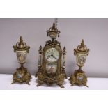 A gilt brass mantle clock with two garnitures, movement by Franz Hermle. Shipping unavailable