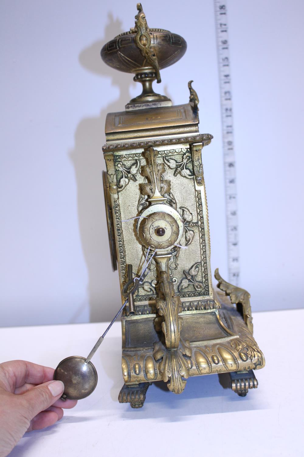 A heavy gilt brass mantle clock with enamel face, with key and pendulum. Shipping unavailable - Image 3 of 4