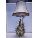 A very ornate ceramic lamp base in the form of a cello with cherubs h100cm, shipping unavailable
