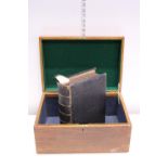 A wooden box with a Victorian family bible