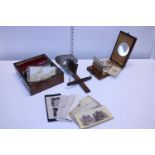 A antique stereoscope with fourteen stereographs plus a graphoscope