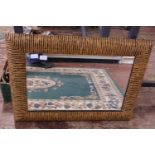 A large mixed wood inlaid mirror, shipping unavailable