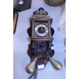 A vintage Dutch wall clock with weights and pendulum a/f, shipping unavailable