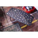 A vintage mid-century coffee table with inlaid coins, shipping unavailable