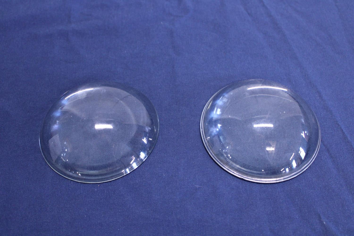 Two table top domed magnifying lenses