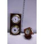 A wooden and brass clock and barometer combo and a desk top barometer