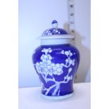 A Chinese prunus blossom lidded jar with blue seal mark to base