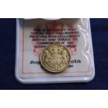 A 9ct gold commemorative coin 2.56g