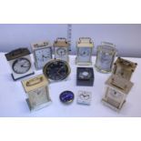 A job lot of assorted brass carriage clocks and other time pieces, shipping unavailable